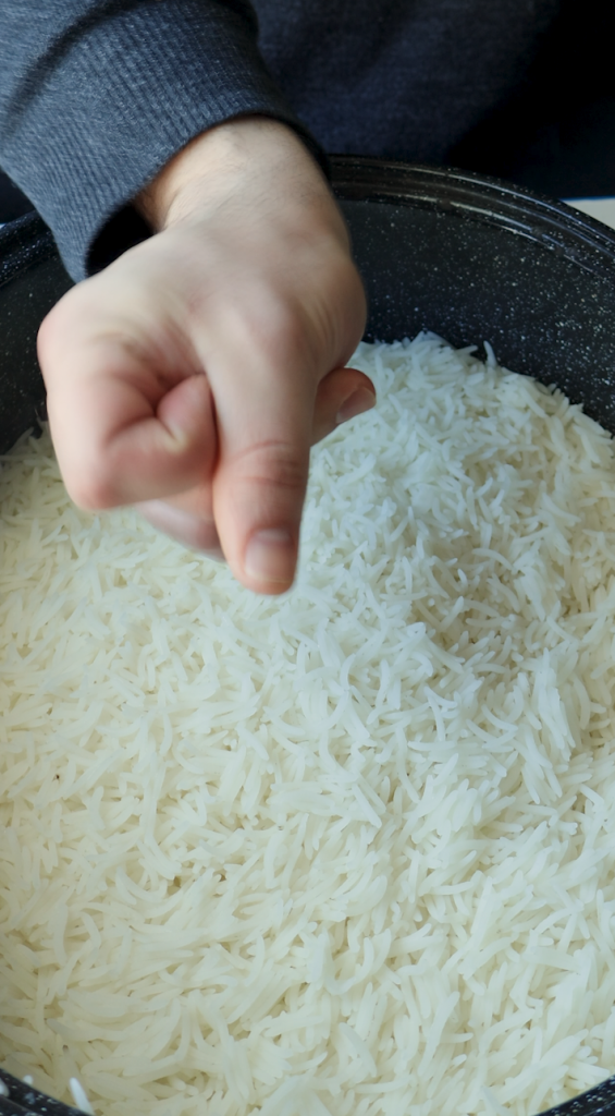 While this is cooking, boil water in a large Dutch oven for basmati rice, parboil the rice, and drain. 